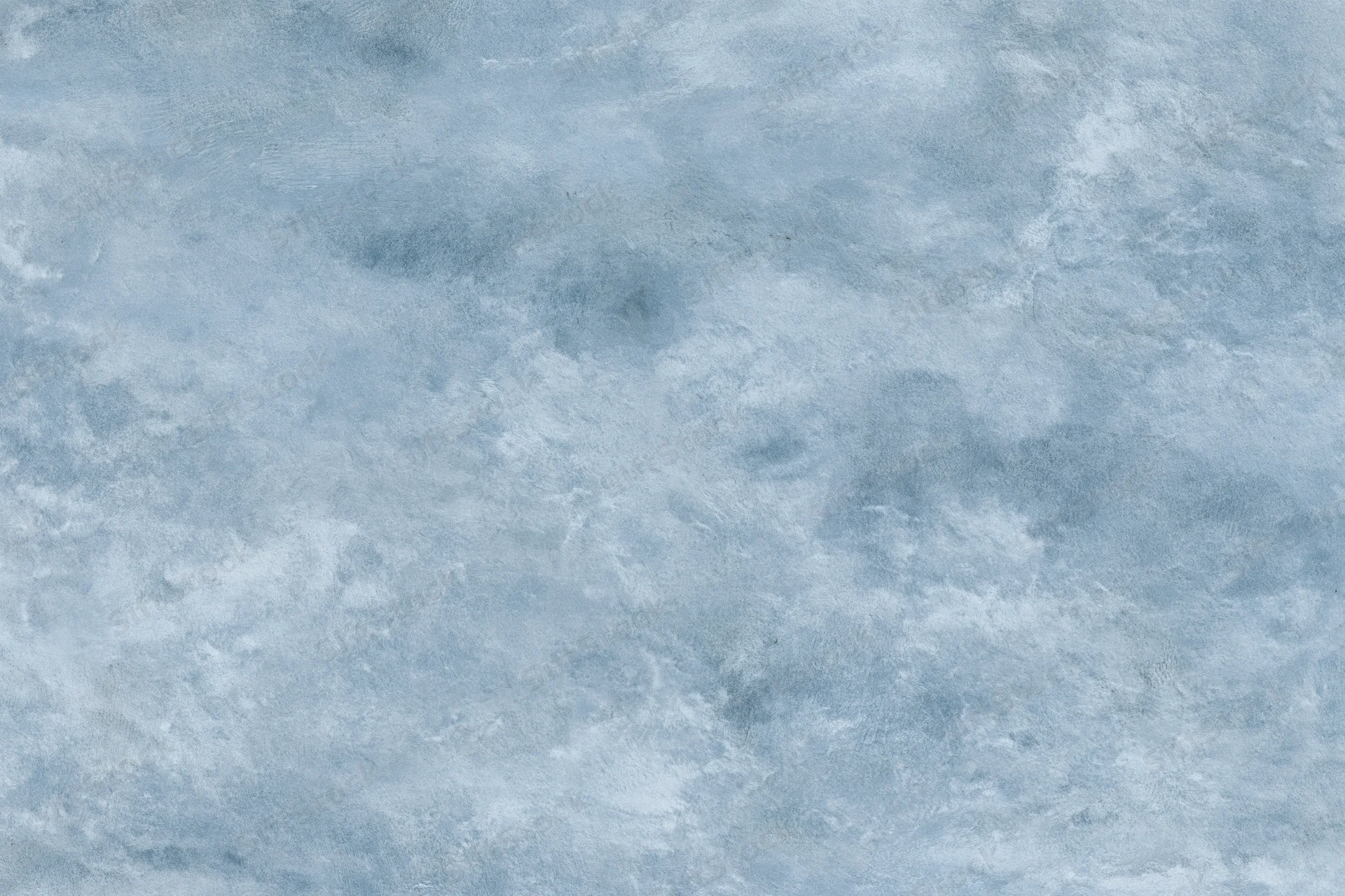 Aged plaster wall surface filling the frame with a weathered blue-gray texture