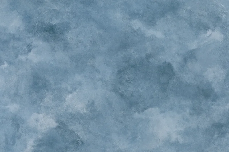 Aged plaster wall surface with mottled blue-gray texture filling the frame
