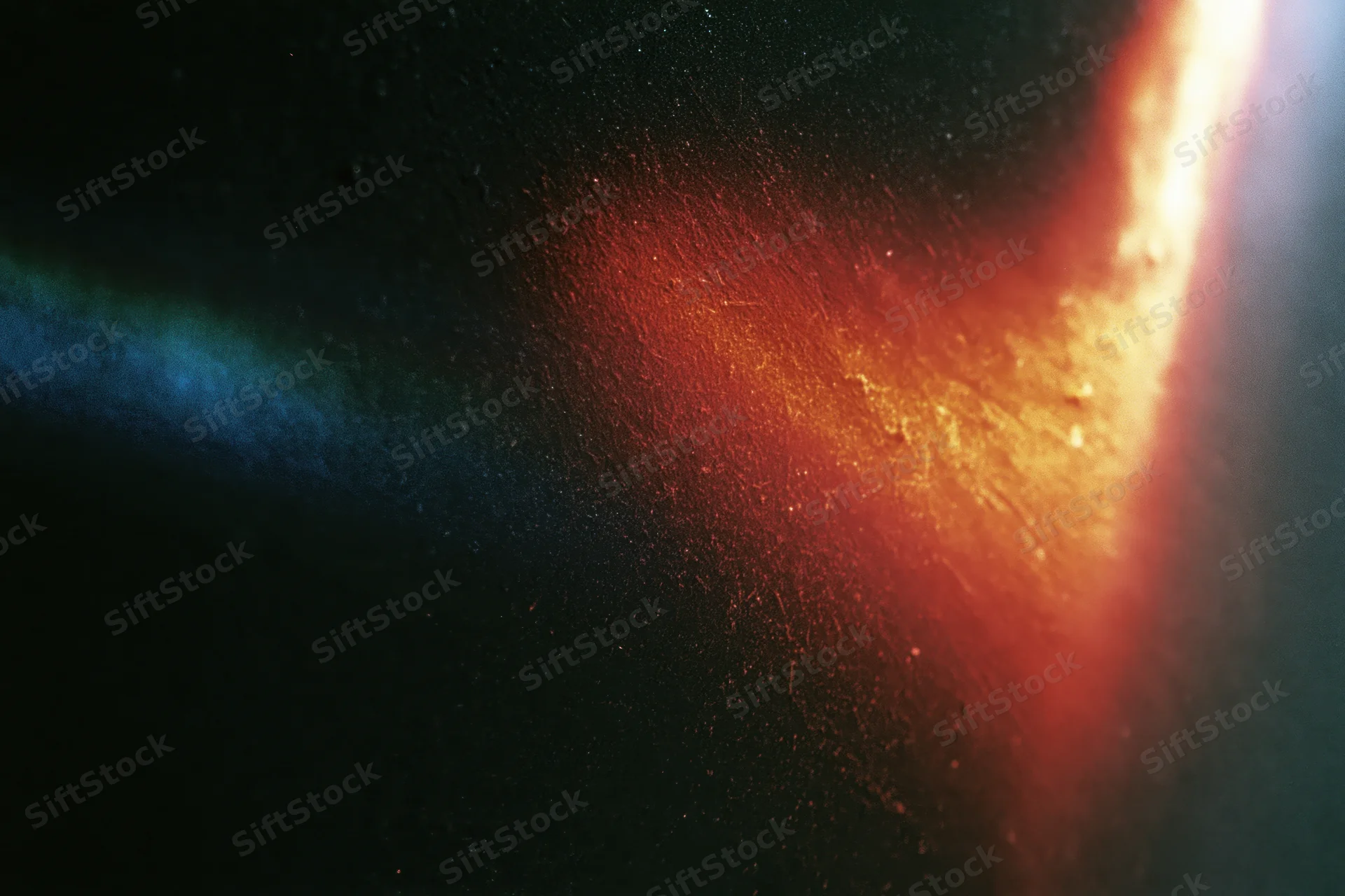 Diagonal light leak overlay on black background with red and blue gradients