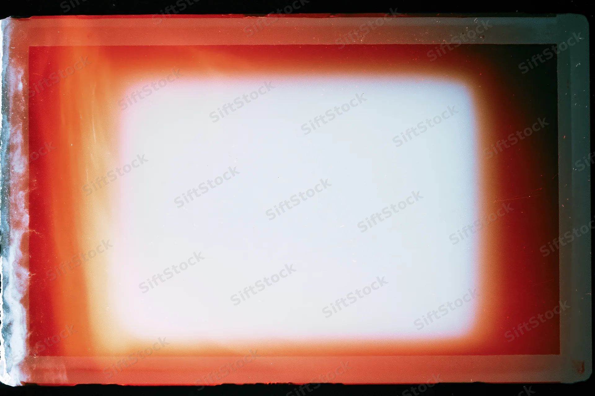 Blank overexposed analog film frame with red-orange light leak border and white center area