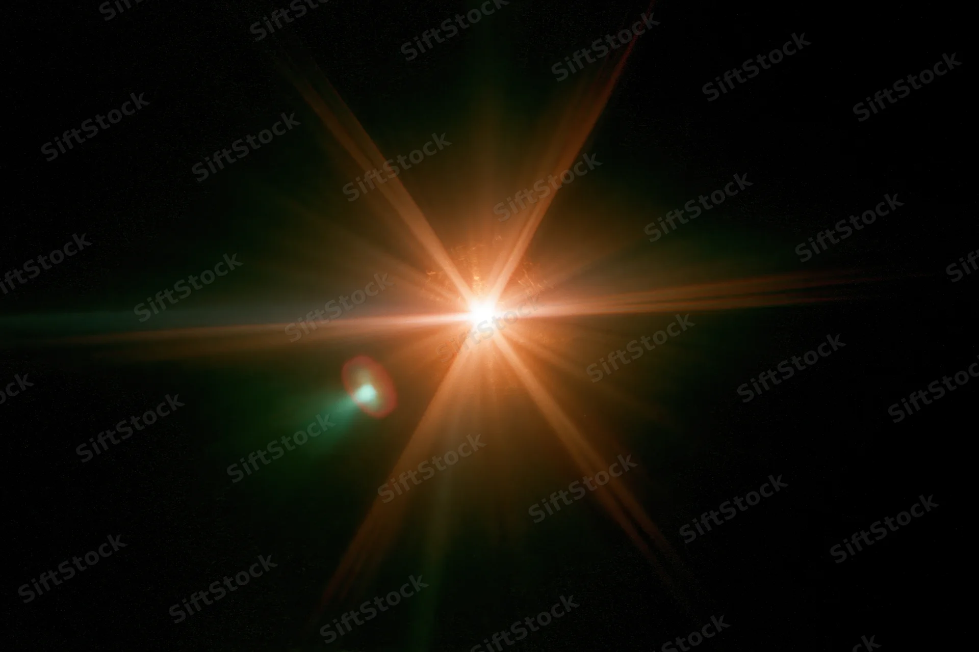 Bright point light source glowing with starburst flare against pure black background