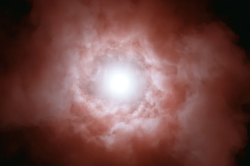 Bright white glowing orb at center surrounded by billowing red and pink clouds