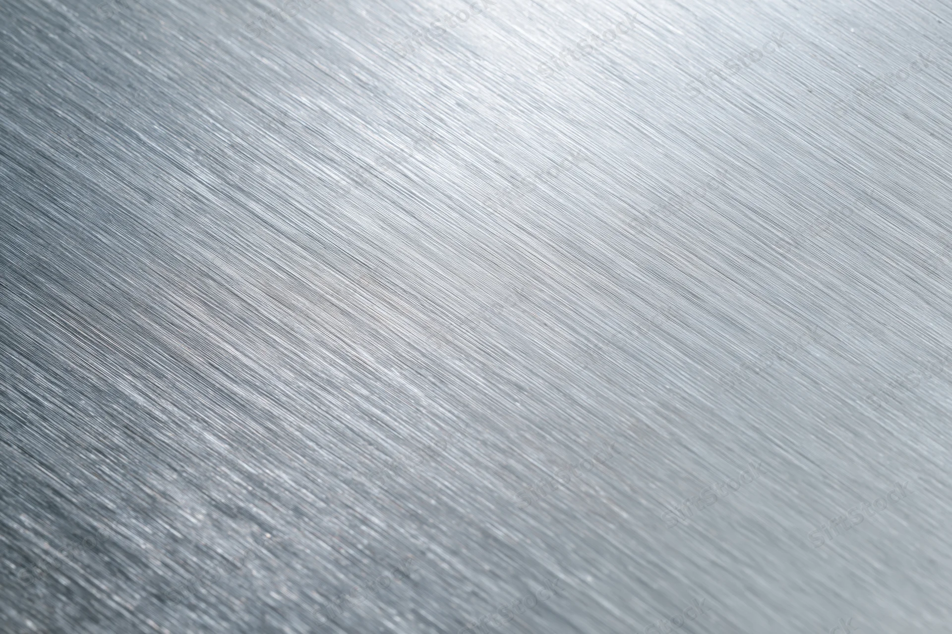Brushed aluminum metal surface in close-up flat-lay view