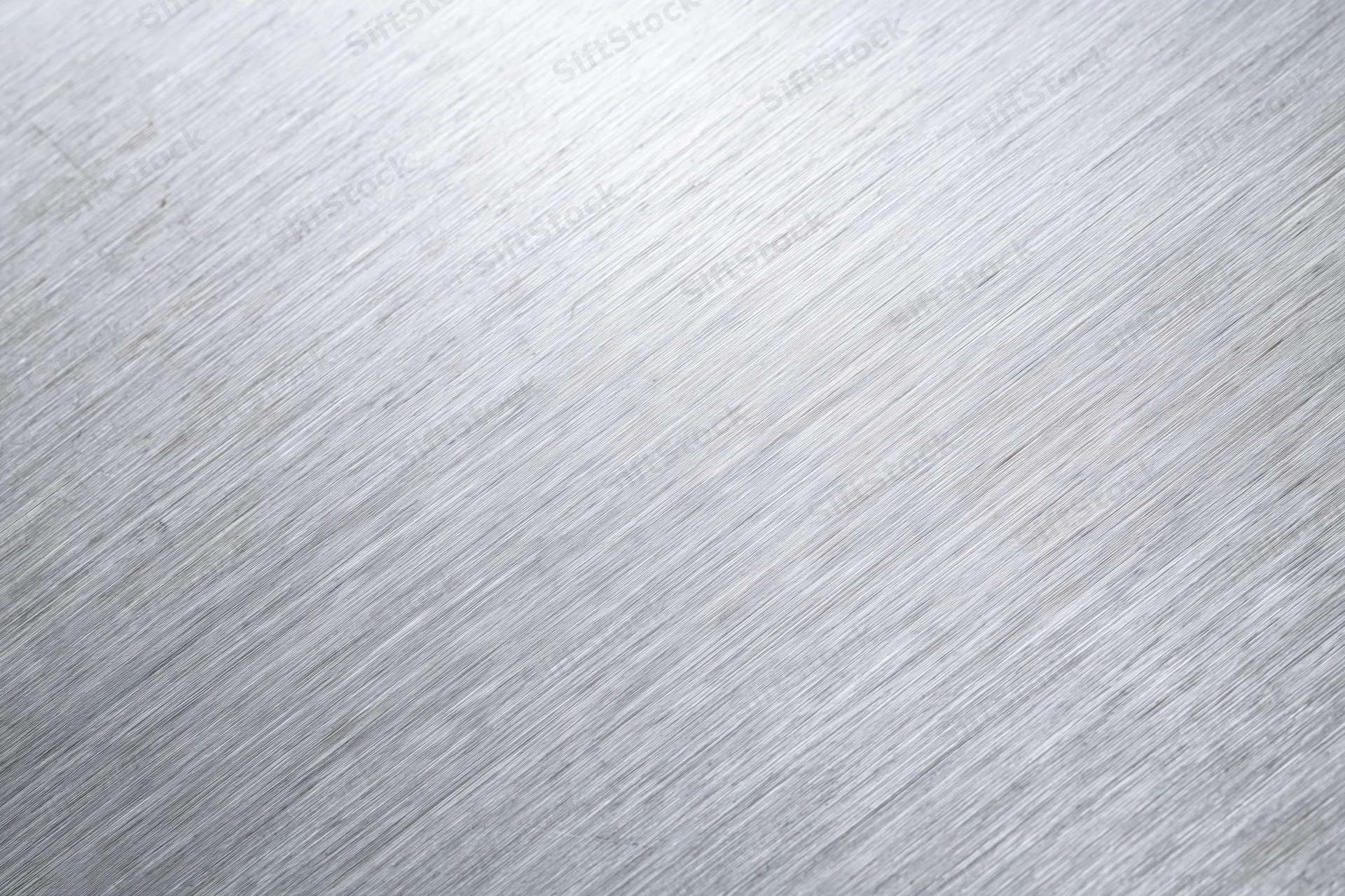 Brushed aluminum metal surface in close-up flat-lay view