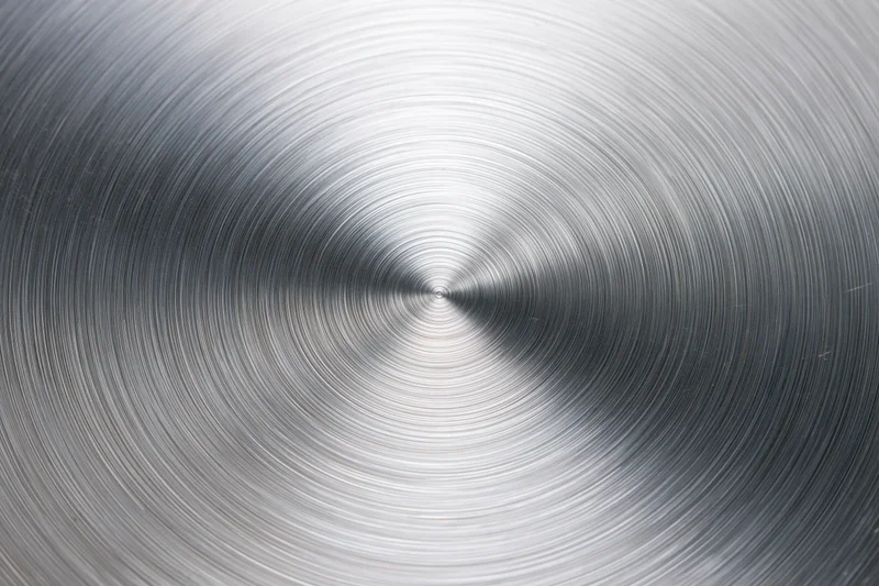 Brushed aluminum metal surface with concentric circular texture