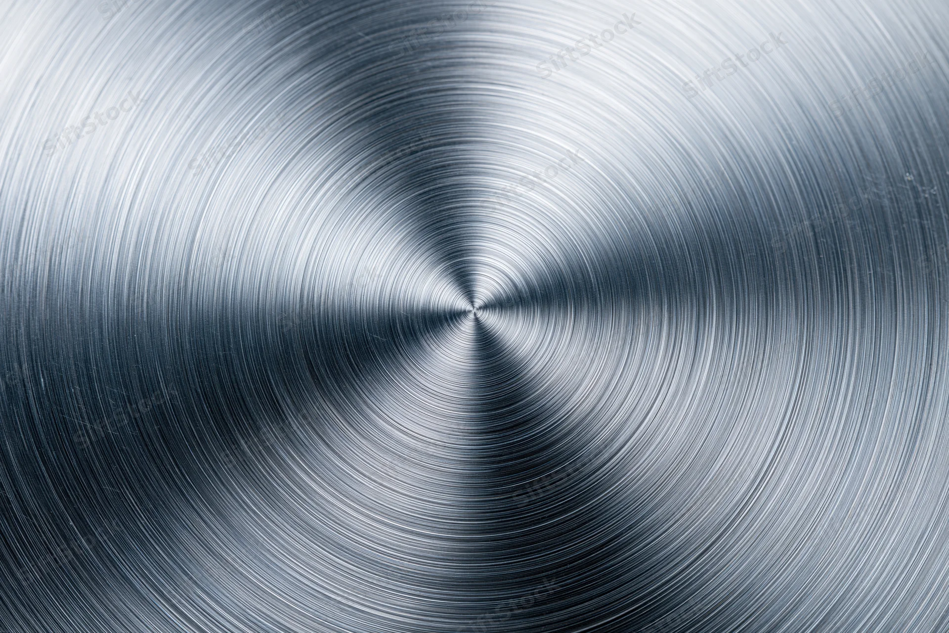 Brushed aluminum metal surface with radial concentric circular texture