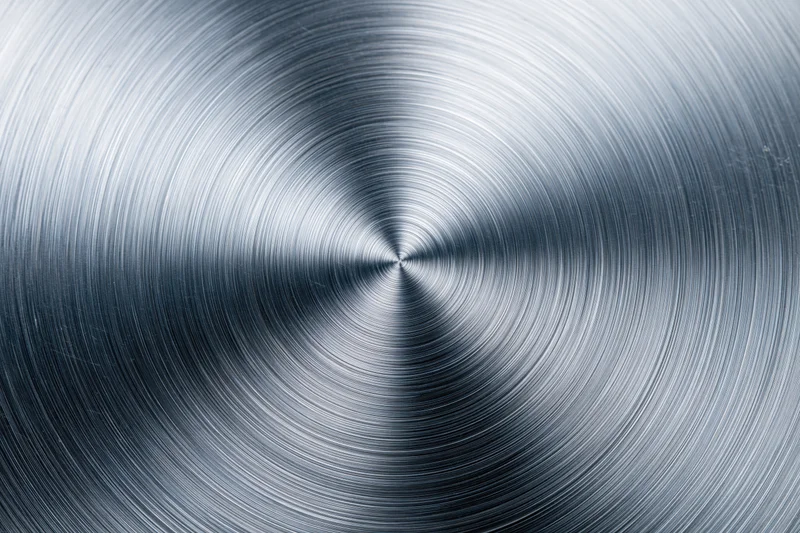Brushed aluminum metal surface with radial concentric circular texture
