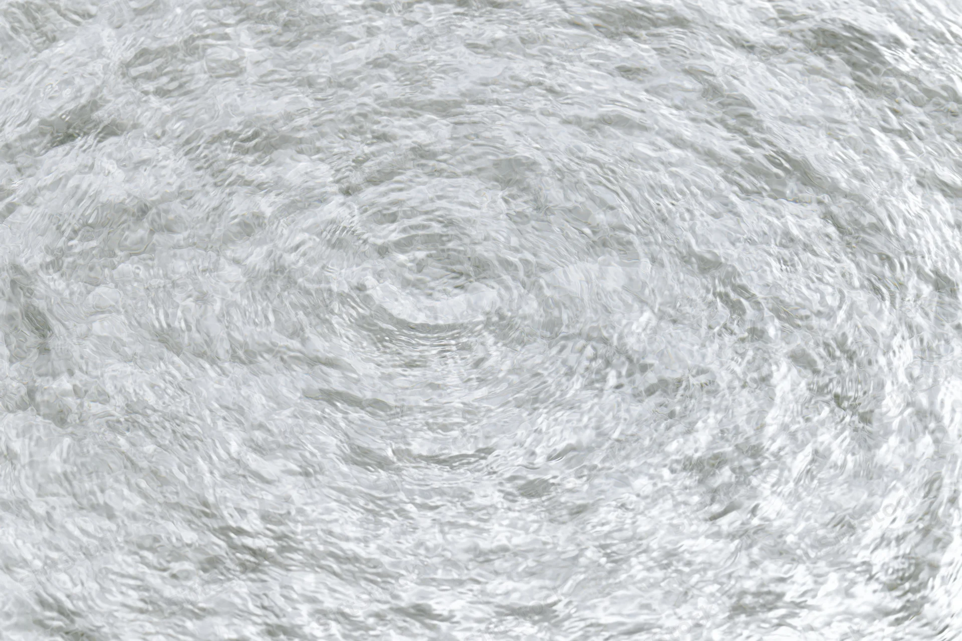Clear shallow water surface with small ripples viewed from directly above