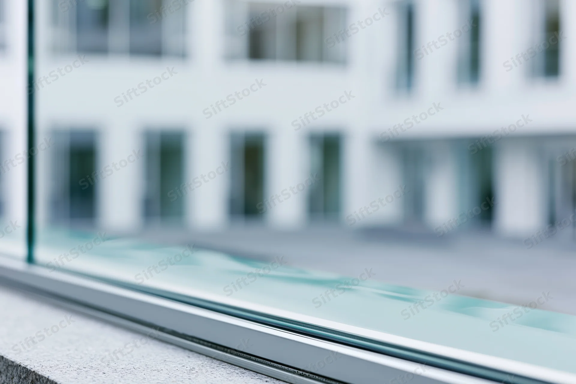 Close-up of glass facade edge on modern office building exterior