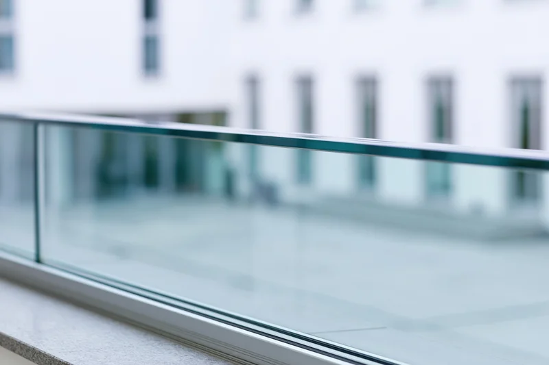 Close-up of glass facade panel edge on modern office building exterior