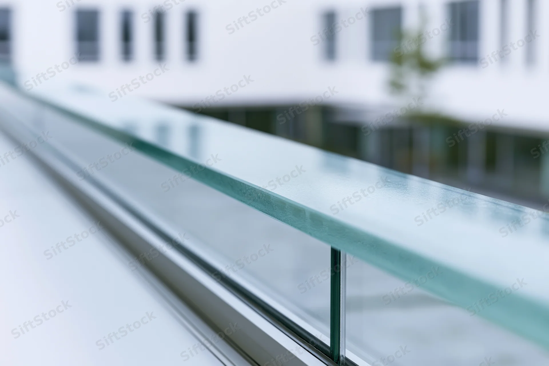 Close-up of glass facade panel edge on modern office building exterior