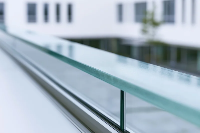 Close-up of glass facade panel edge on modern office building exterior