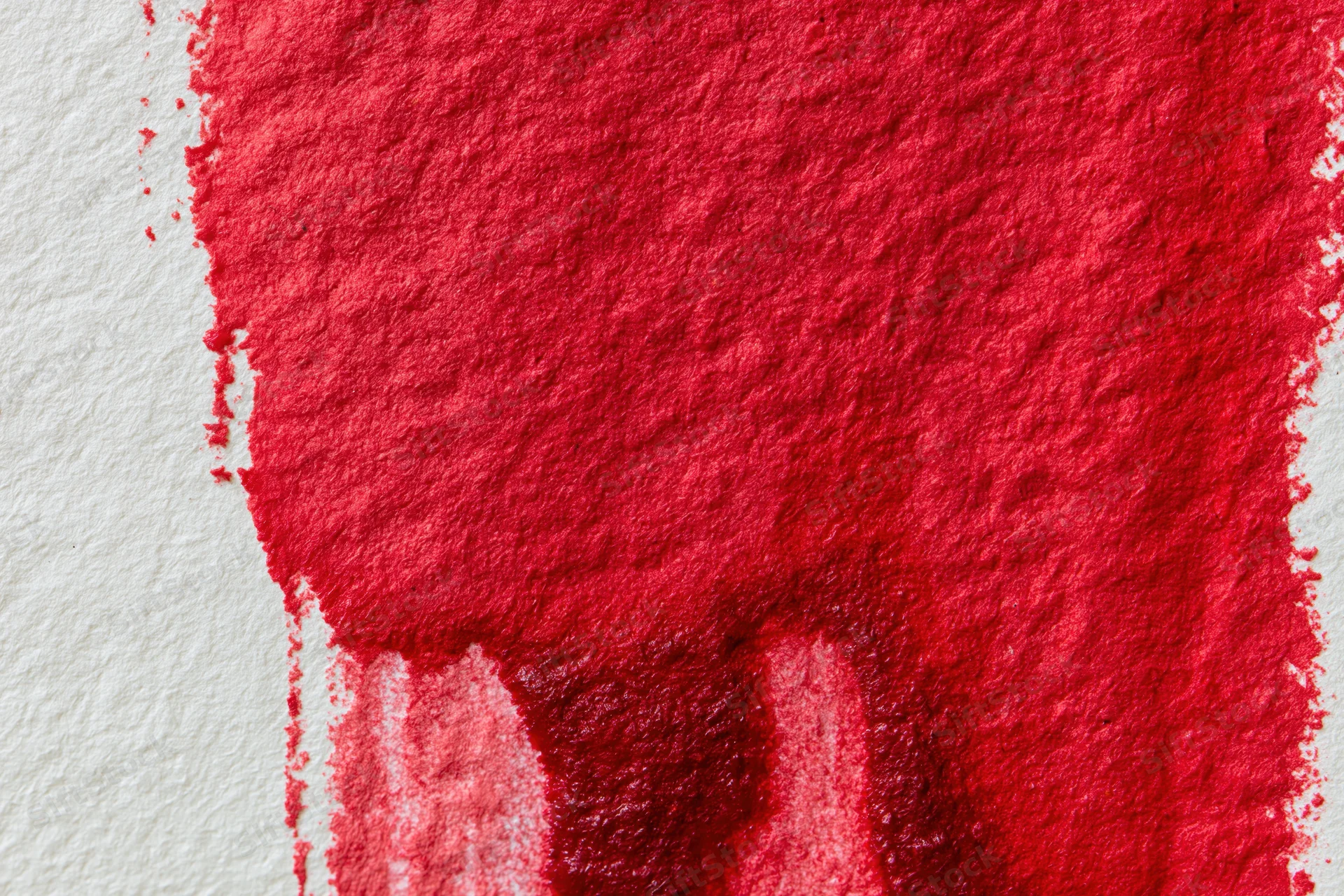 Hand-painted red watercolor wash on textured paper with visible brush strokes and color bleed