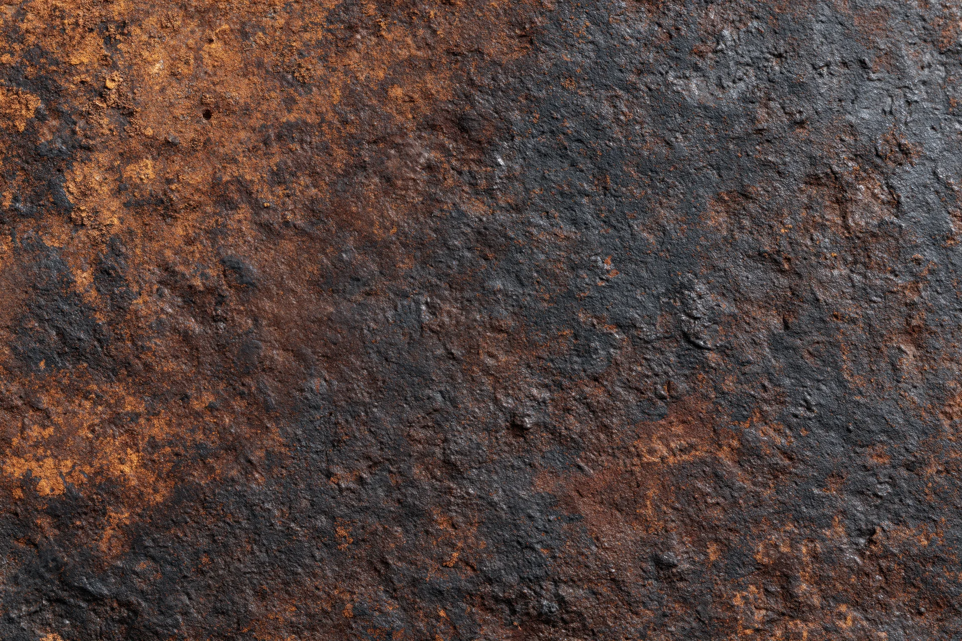 Close-up of heavily oxidized metal surface with rust and corrosion patterns