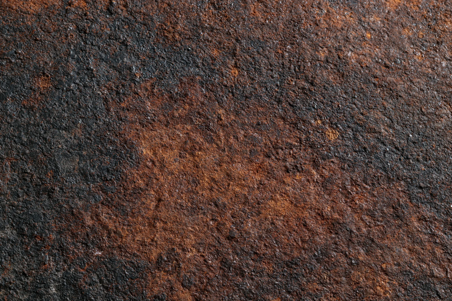 Close-up of heavily oxidized metal surface showing rust and corrosion texture