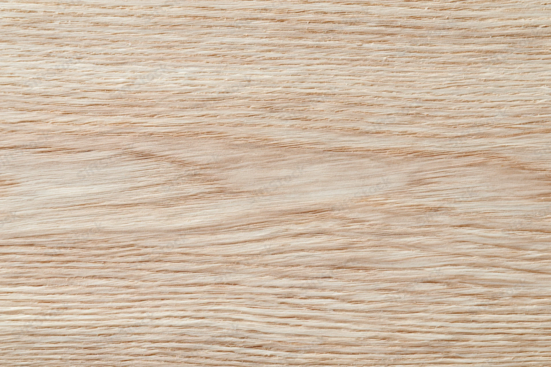 Close-up flat lay of light oak wood surface with horizontal grain pattern