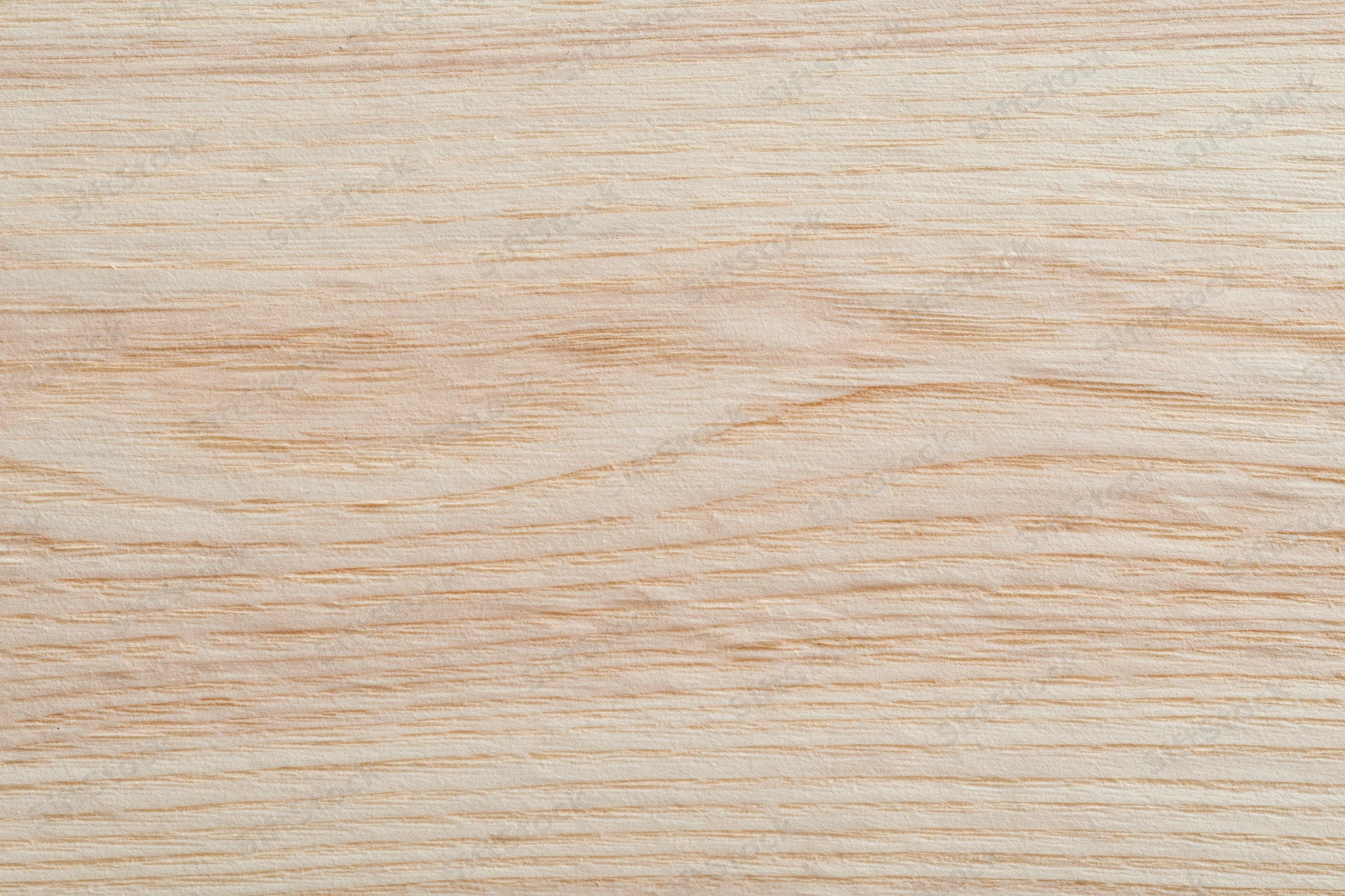 Close-up flat lay of a pale bleached wood surface filling the frame