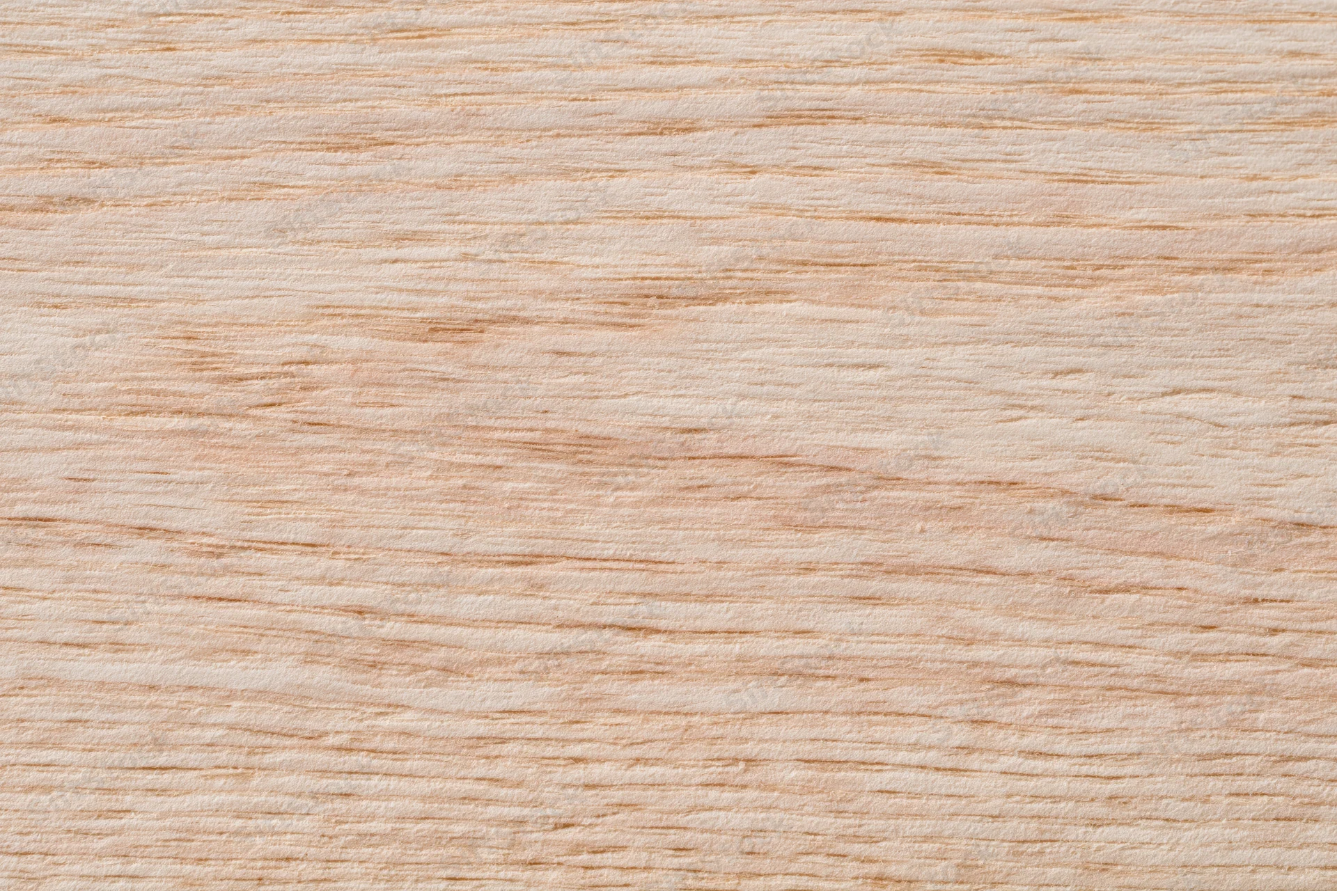 Close-up flat lay of a pale bleached wood surface filling the frame