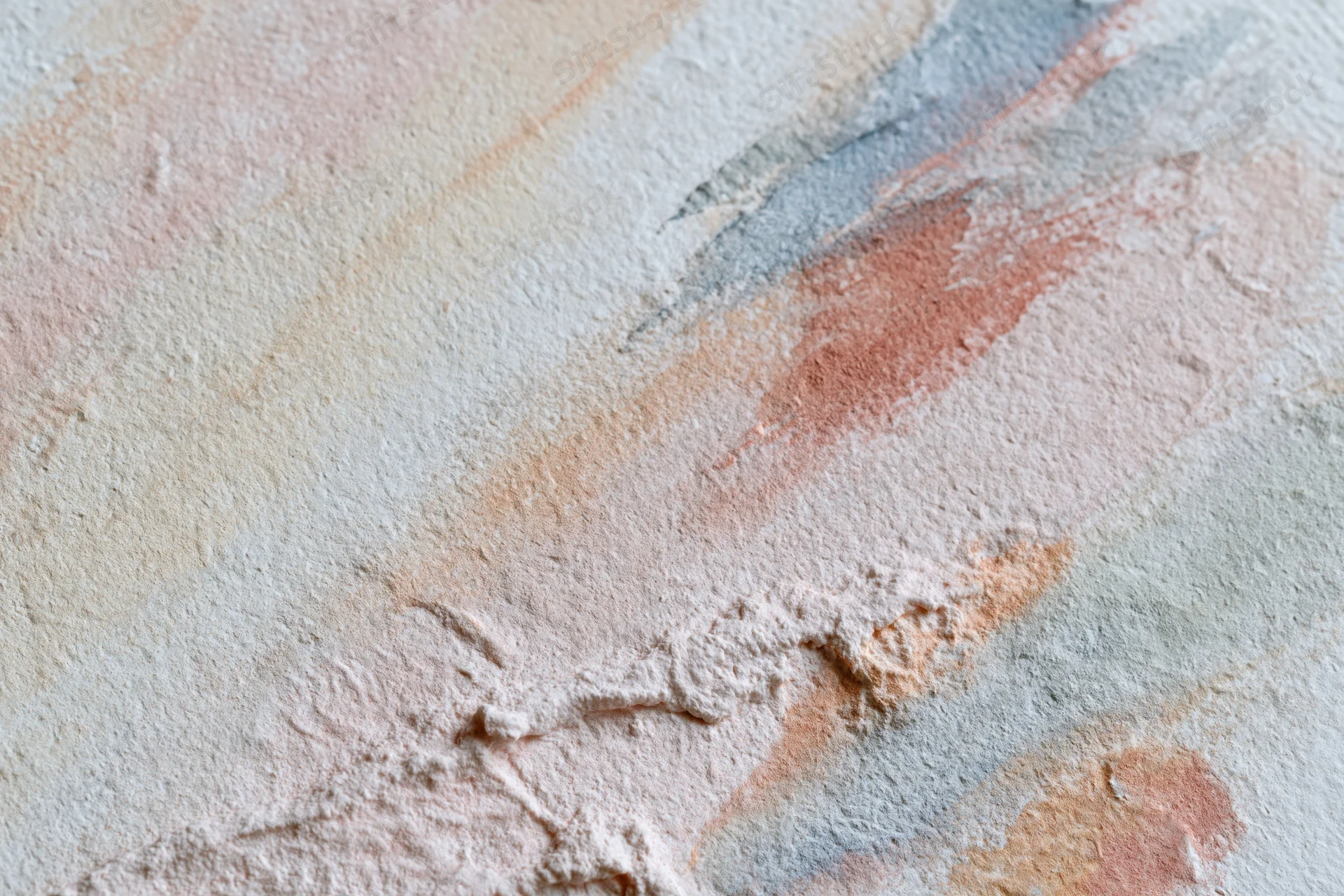 Textured painted canvas surface with abstract brushstrokes in pastel colors, flat lay view