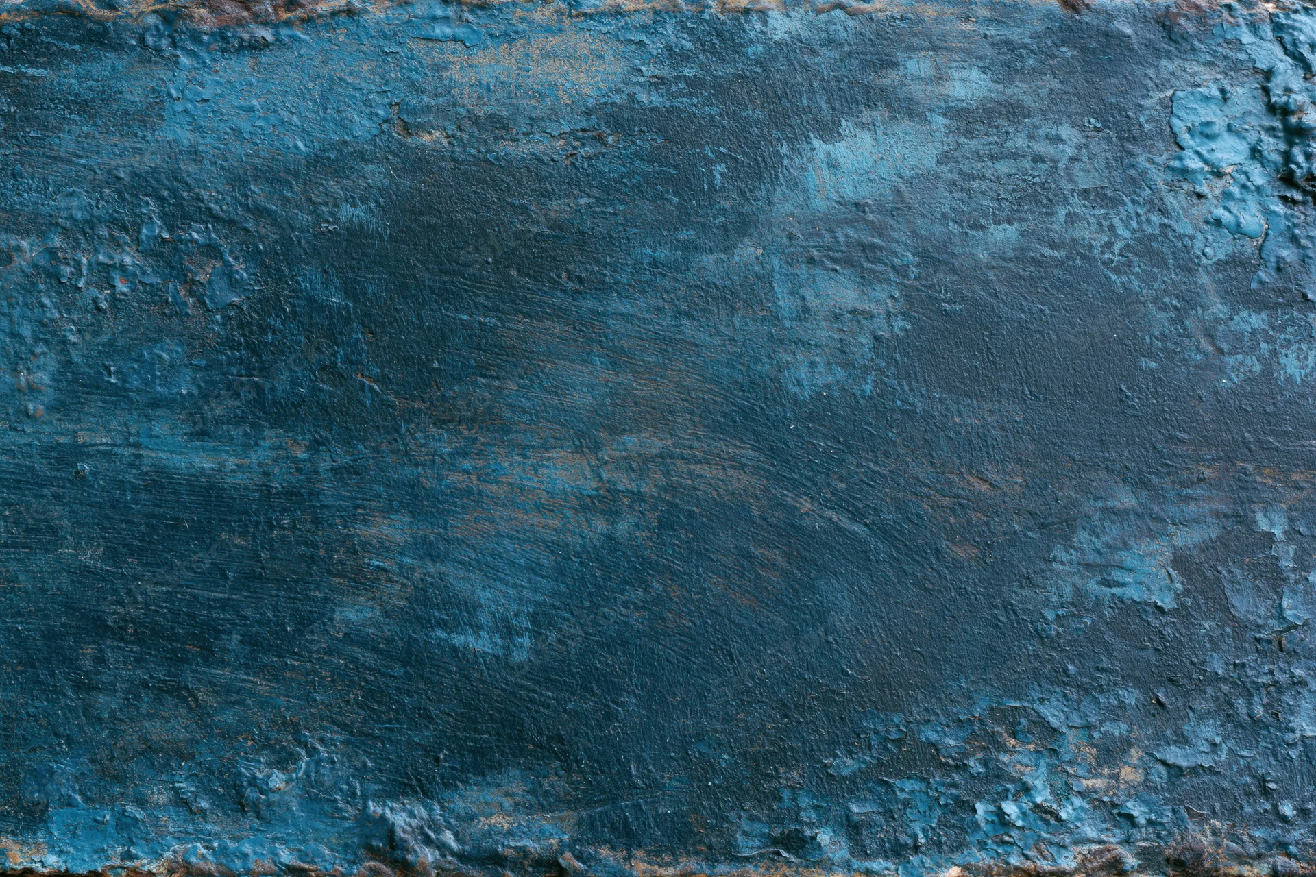 Weathered blue painted metal surface with peeling paint and rust in close-up flat lay