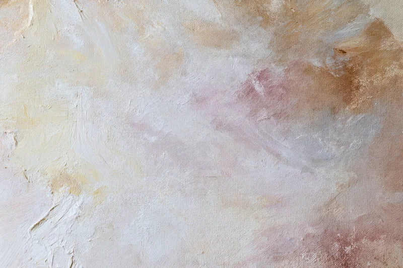 Close-up of abstract painted canvas surface with textured brushstrokes in neutral tones