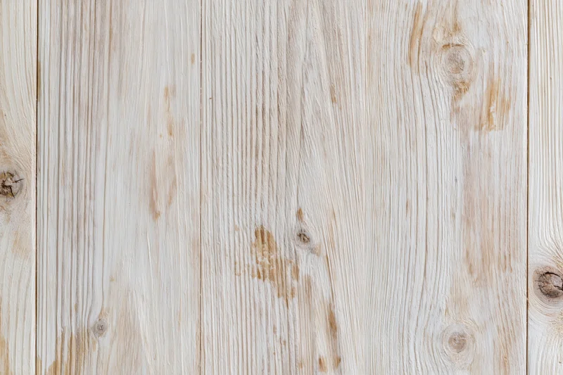 Pale bleached wood planks arranged horizontally as a flat lay surface