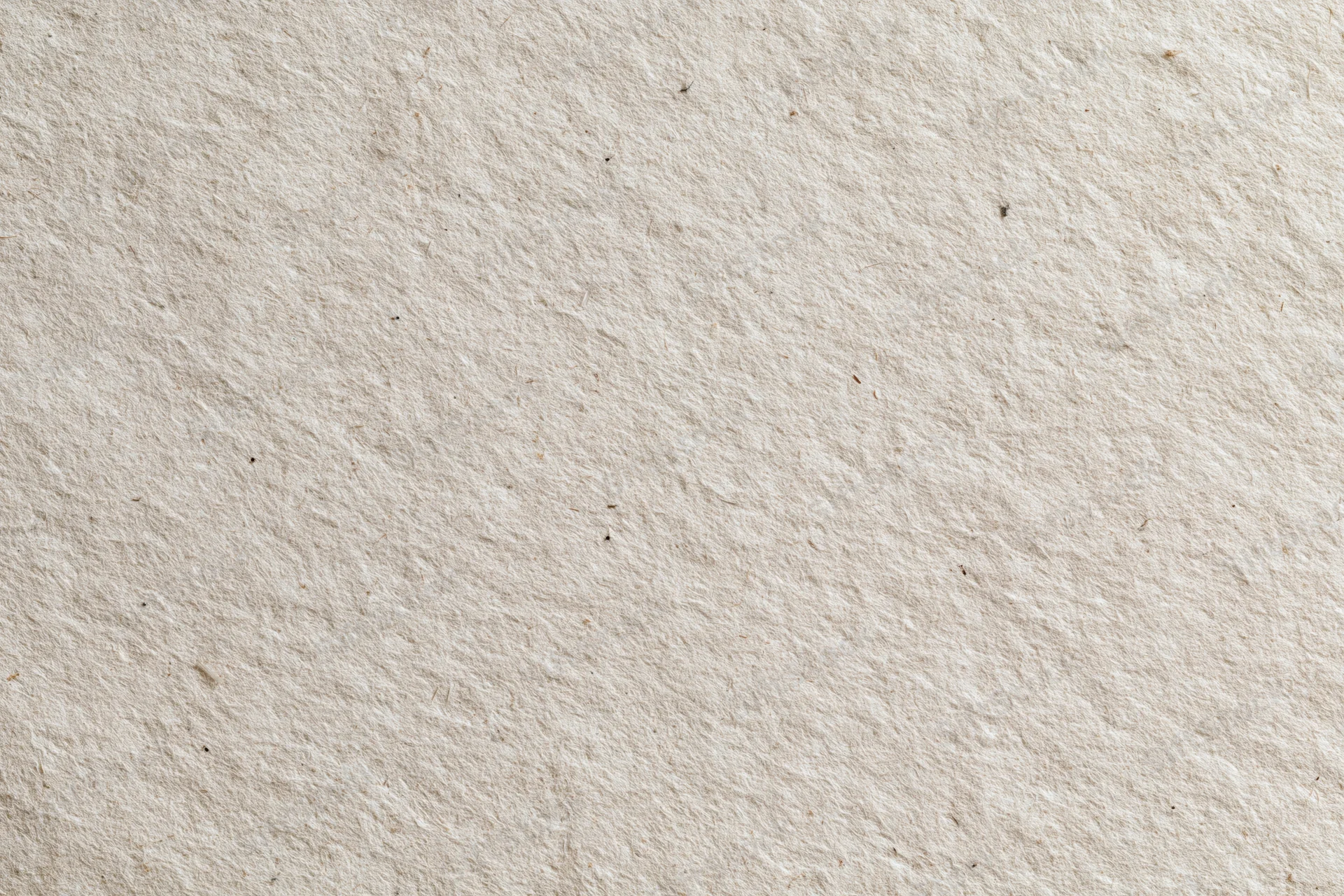 Close-up flat lay of recycled kraft paper surface filling the frame