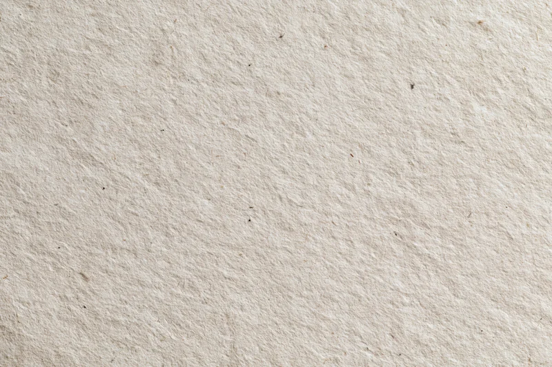Close-up flat lay of recycled kraft paper surface filling the frame