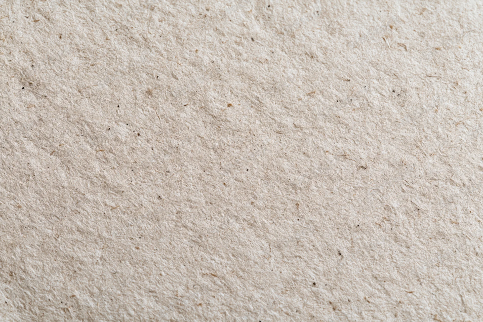 Close-up flat lay of recycled kraft paper surface filling the frame