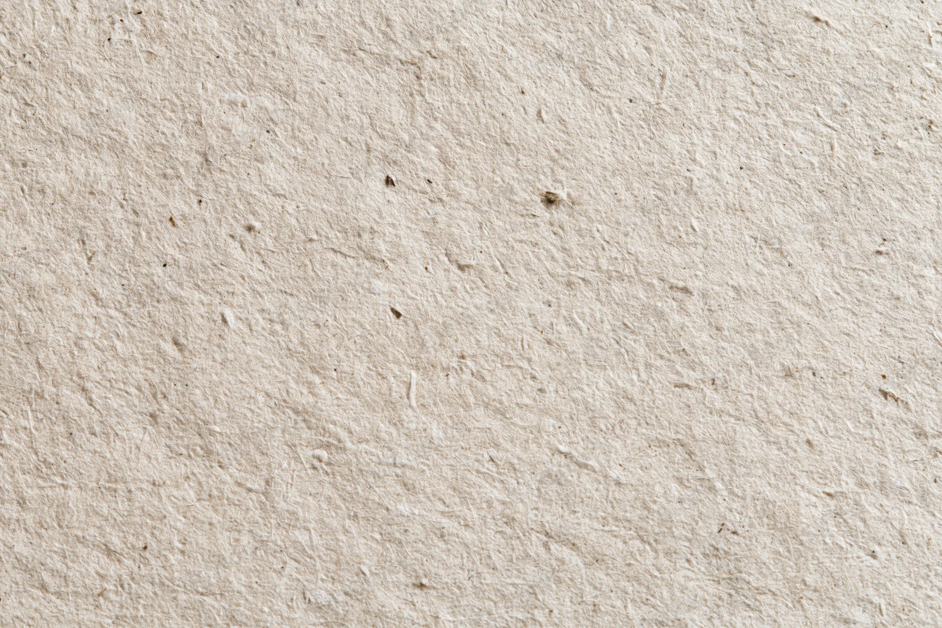 Close-up flat lay of recycled kraft paper surface filling the frame