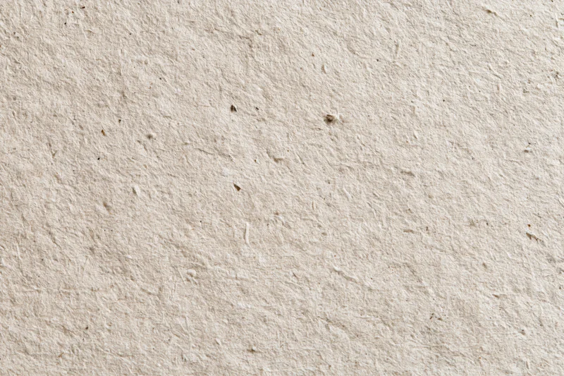 Close-up flat lay of recycled kraft paper surface filling the frame