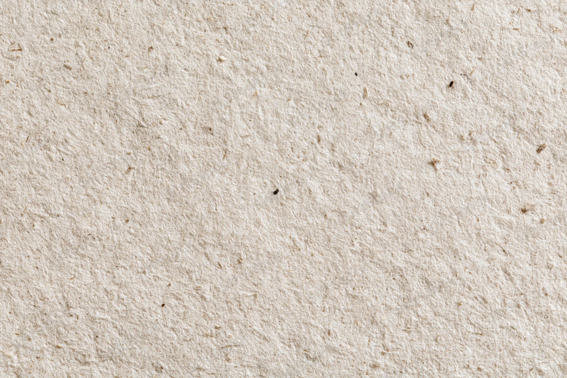 Close-up flat lay of recycled kraft paper surface filling the frame