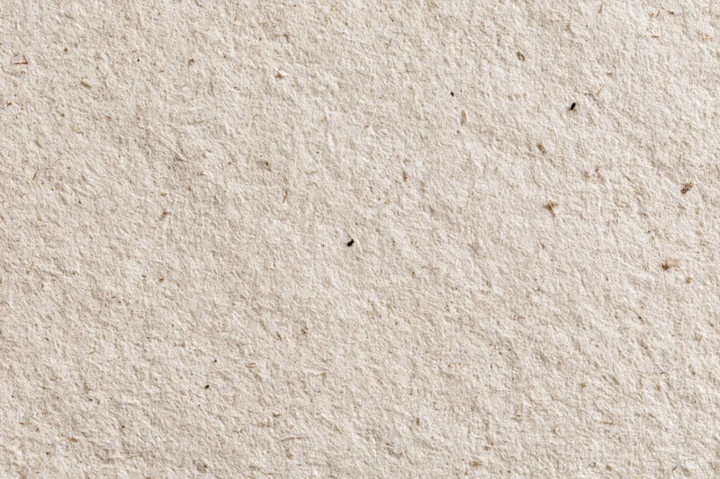 Close-up flat lay of recycled kraft paper surface filling the frame