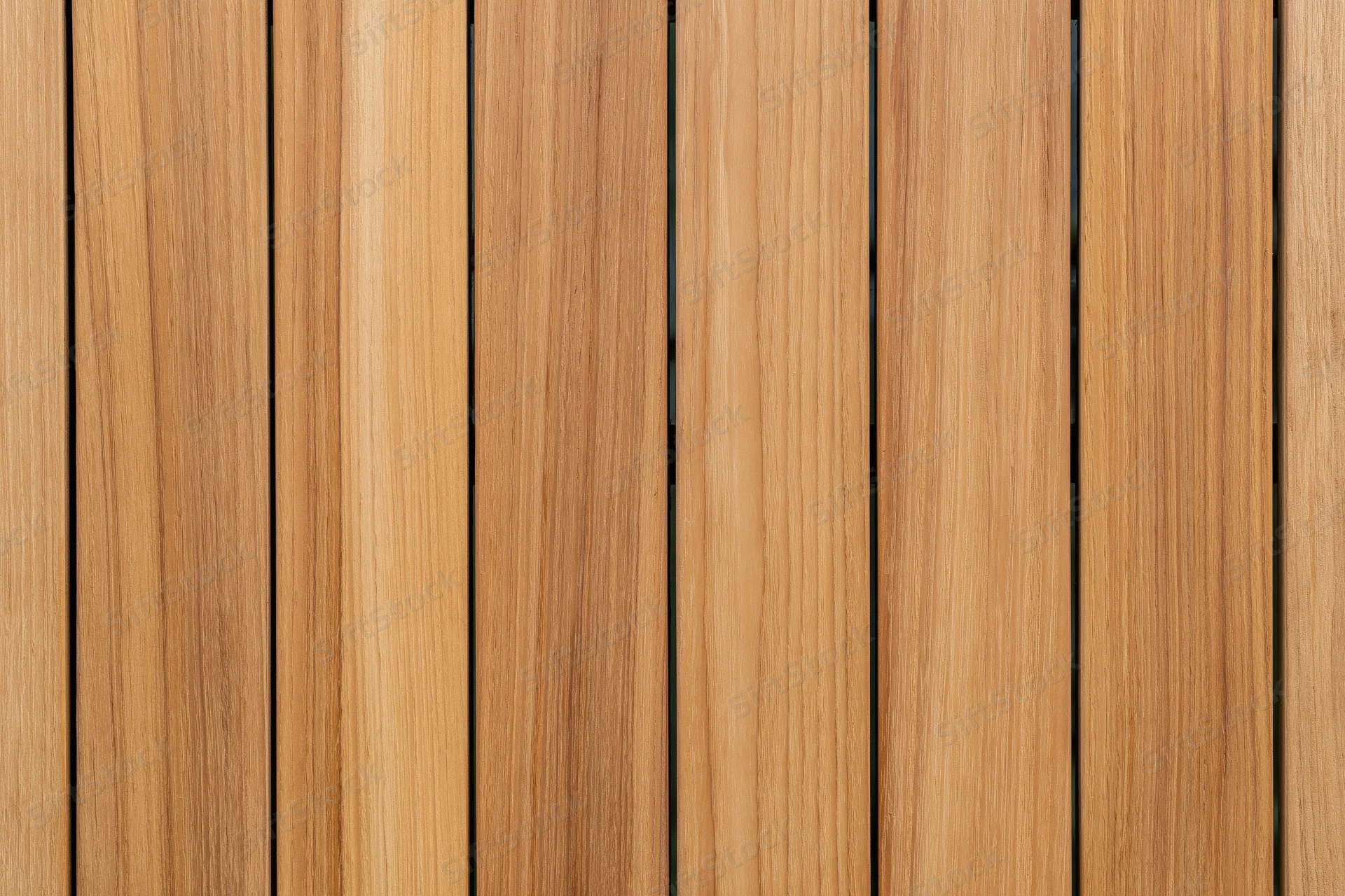 Vertical teak wood planks arranged in a flat lay close-up view