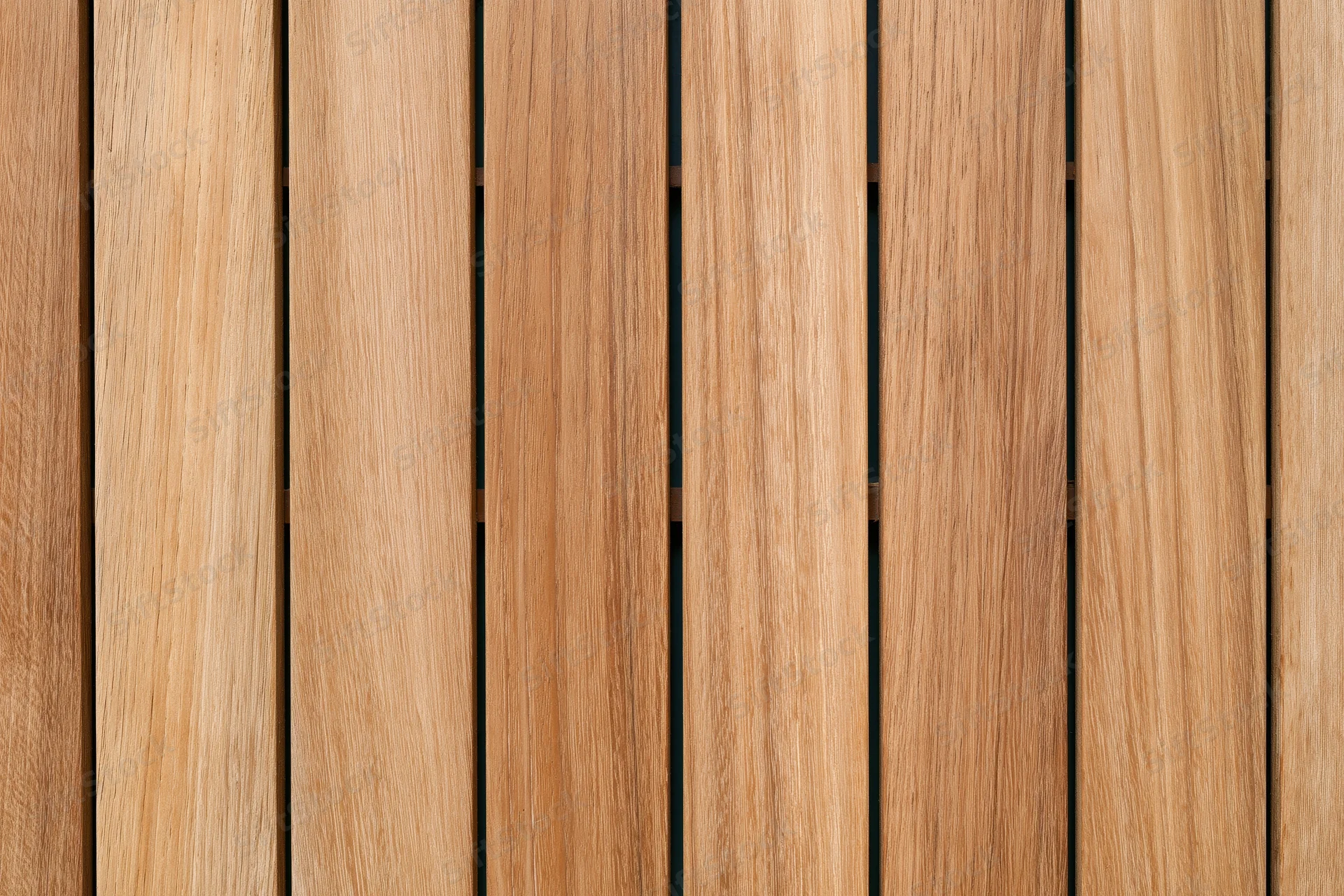 Vertical teak wood planks arranged in parallel rows forming a flat surface