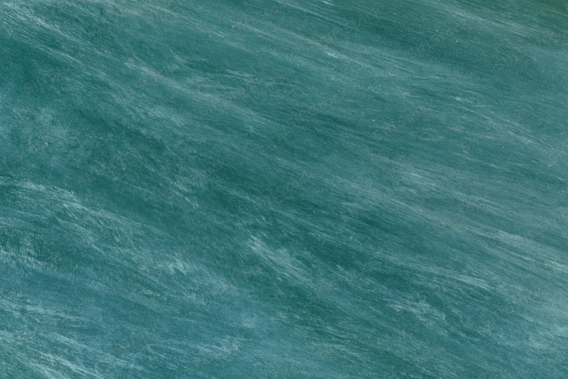 Close-up flat view of a blank green chalkboard surface in a classroom