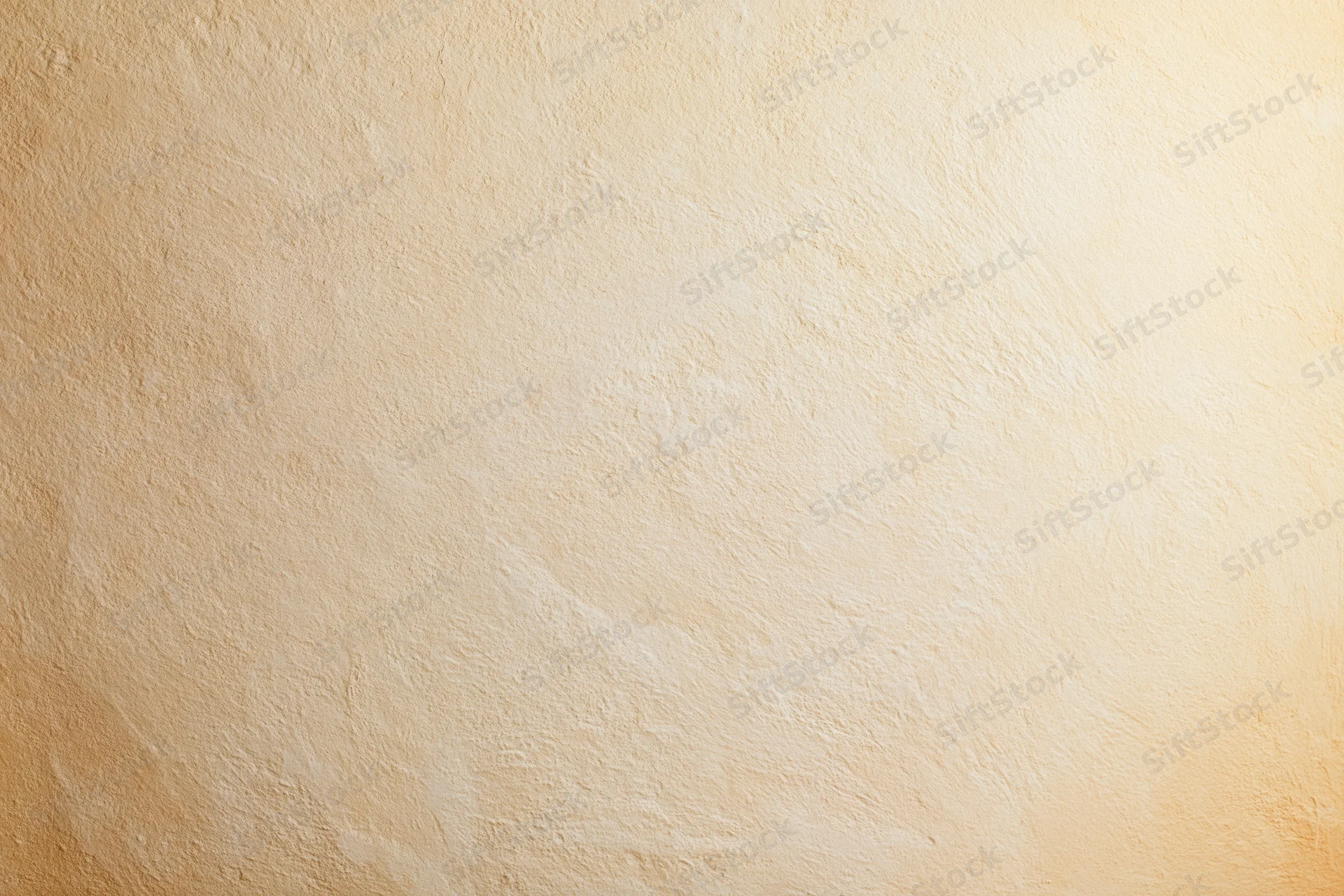 Close-up of a plain painted concrete wall surface with smooth texture and neutral beige tone