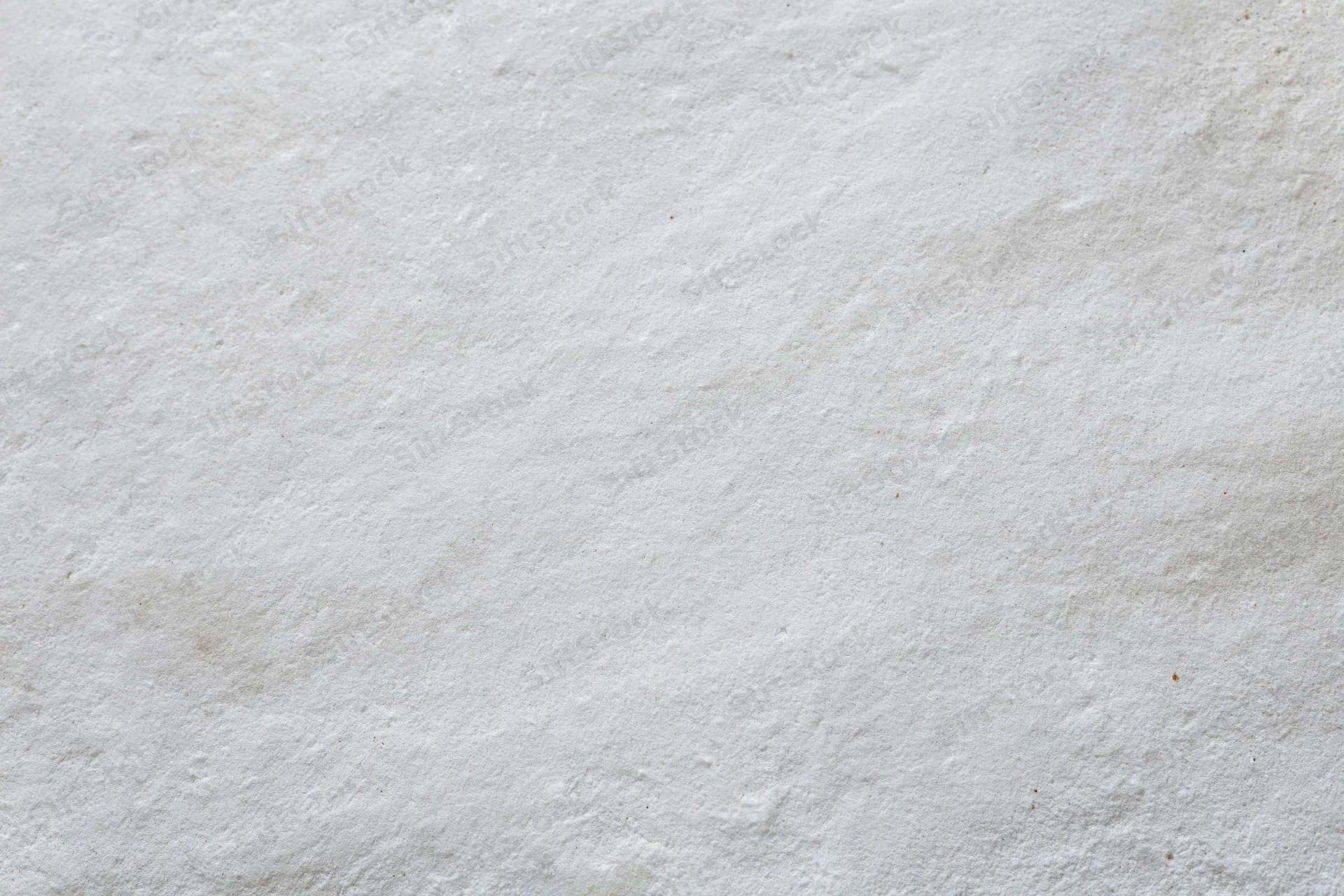 Close-up of a plain white painted concrete wall surface