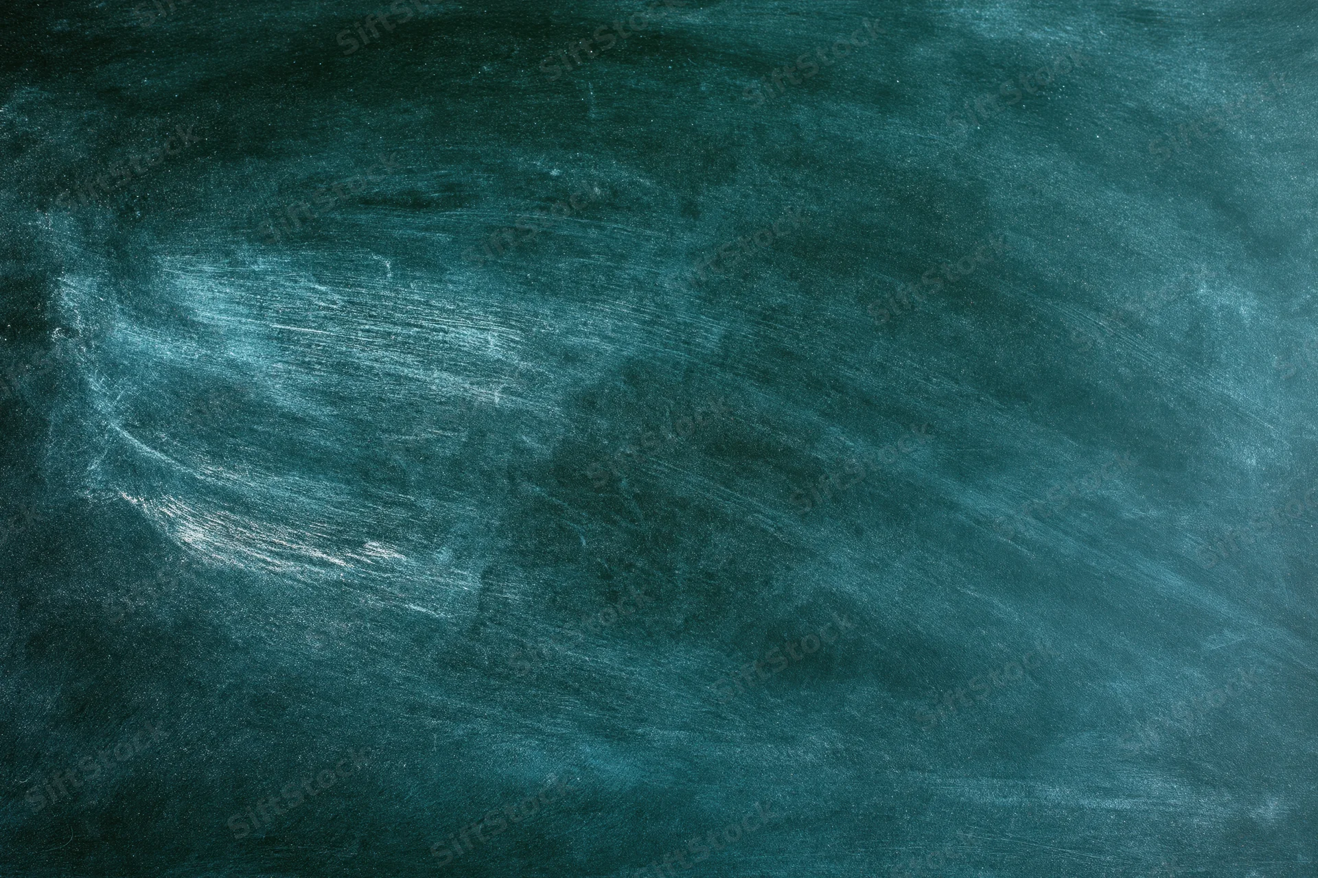 Worn green chalkboard surface with smudged chalk residue and texture, flat close-up view