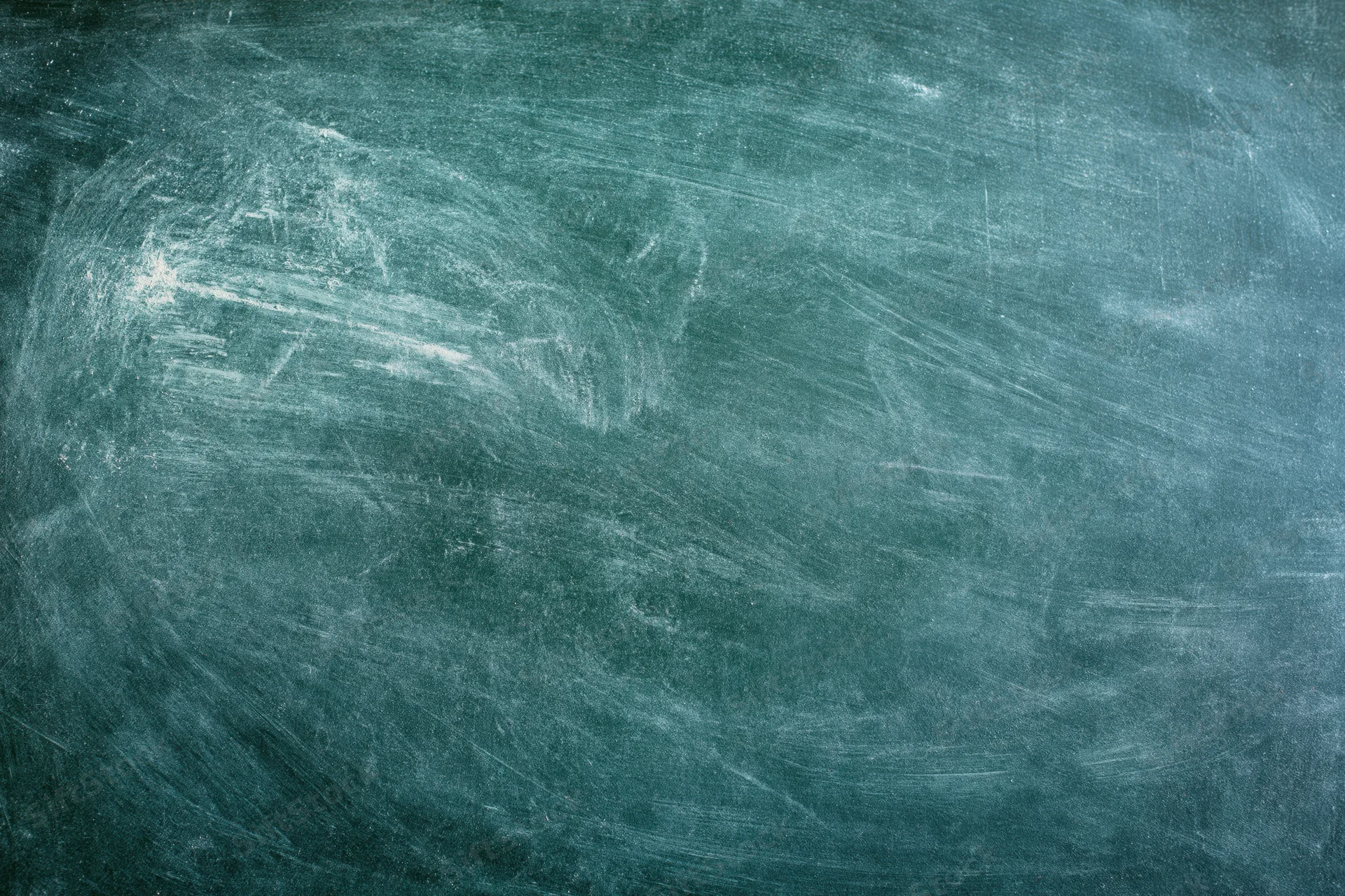 Worn green chalkboard surface with smudged white residue and scratches, showing texture and eraser marks