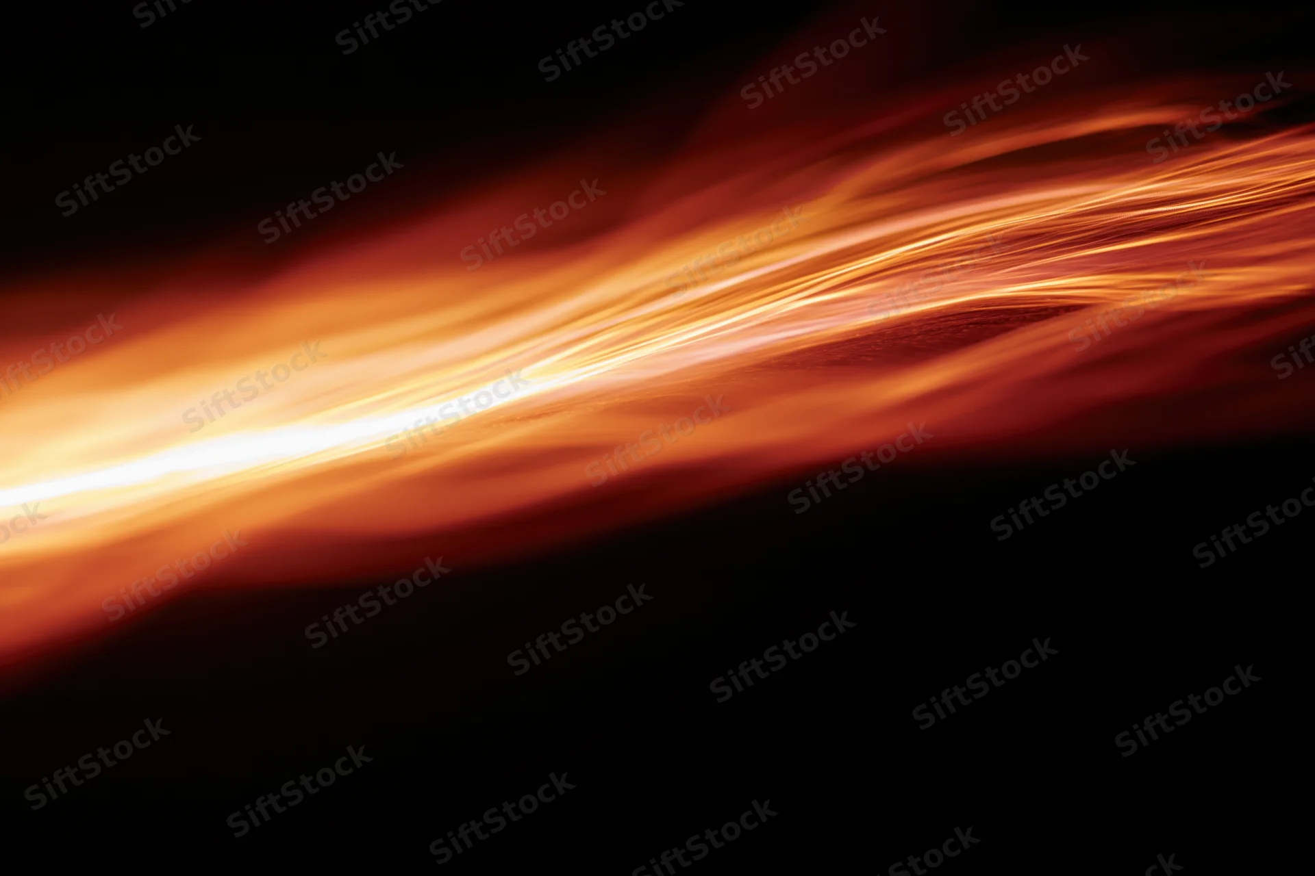 Molten light streaks flowing across dark space in long-exposure photograph