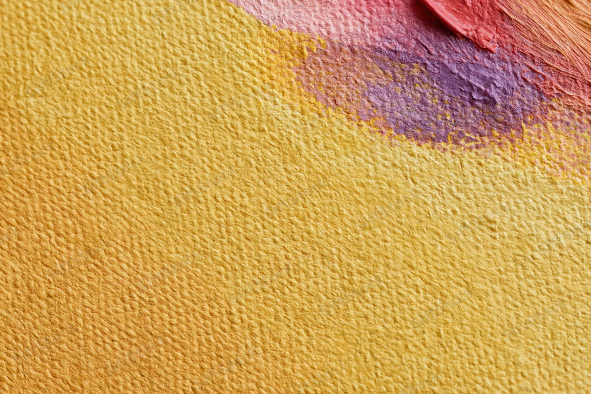 Close-up of textured canvas with yellow and red-purple paint strokes showing impasto texture