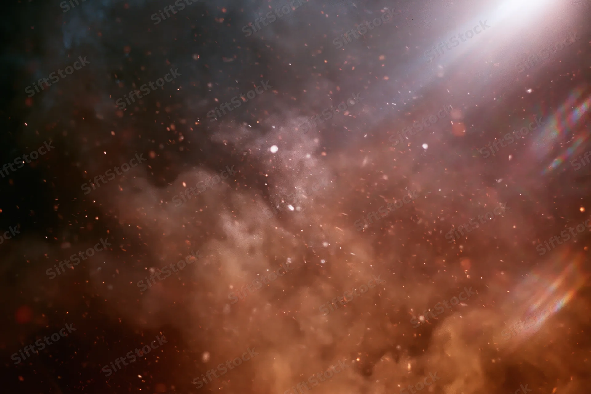 Airborne embers and sparks floating in dark smoke with glowing light trails and lens flare