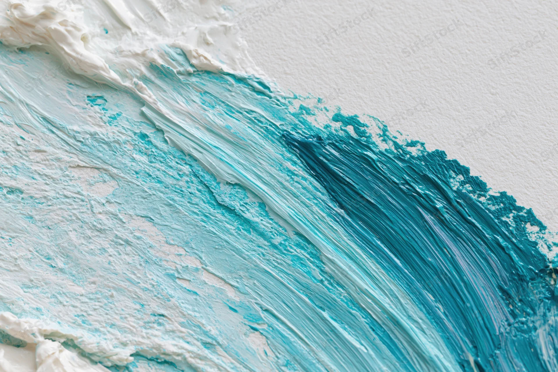 Thick acrylic paint brushstrokes in blue and white on textured canvas surface