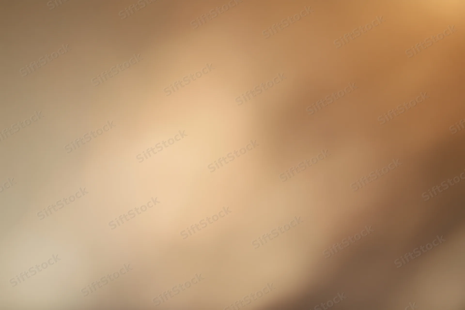 Warm-toned blurred abstract background with soft gradient and bokeh effect