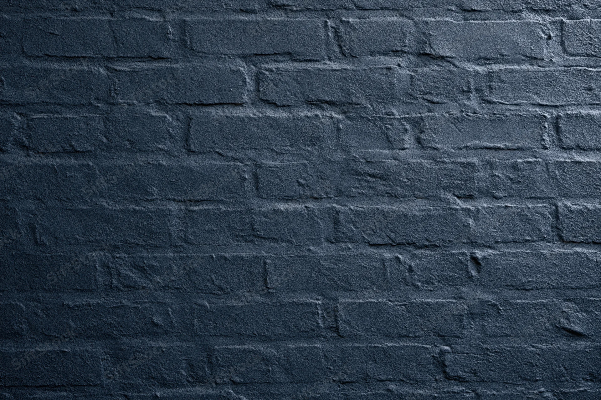 Navy-painted brick wall filling the frame flat-on
