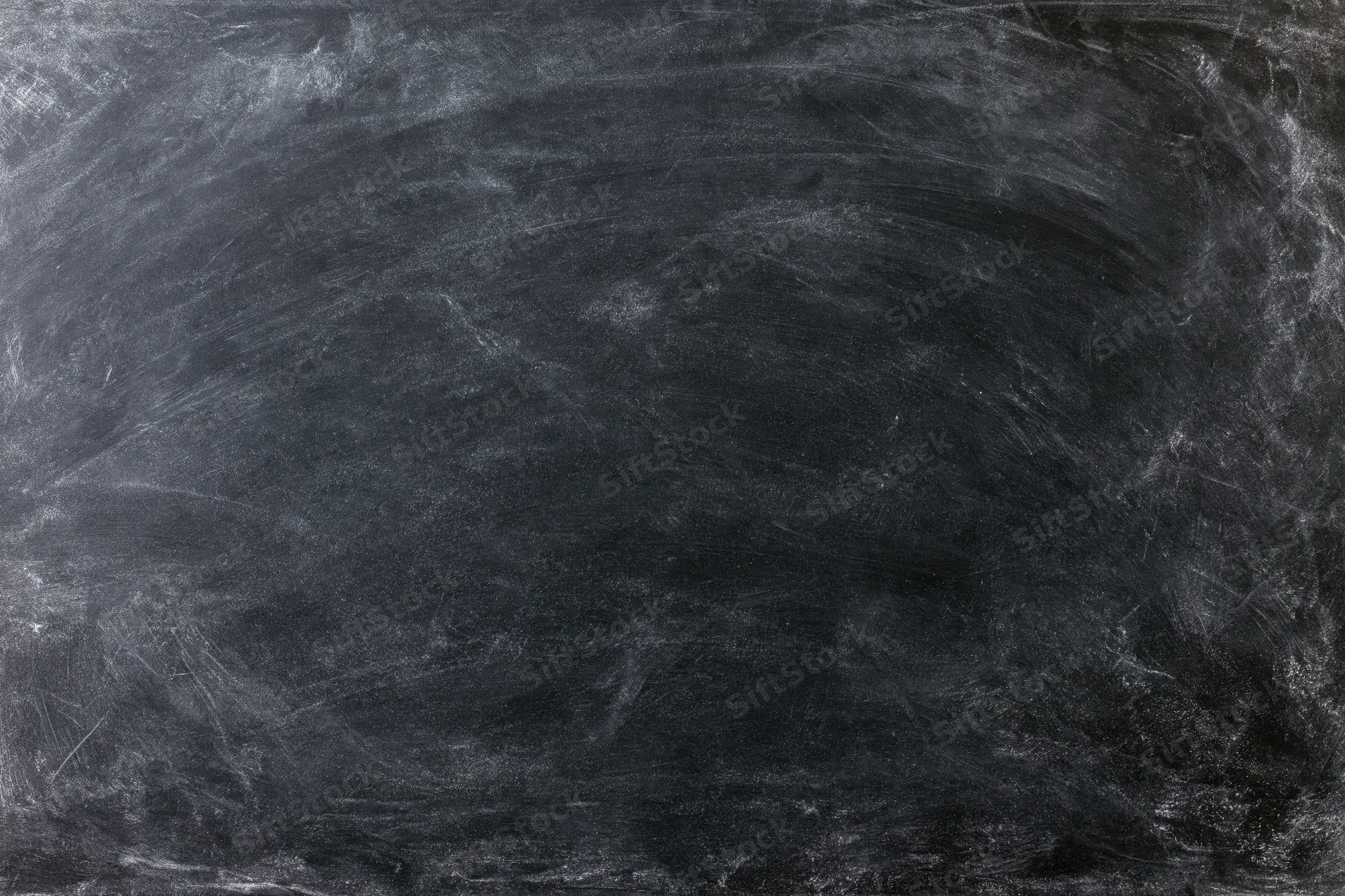 Empty blackboard surface with chalk smudges and scratches filling the frame