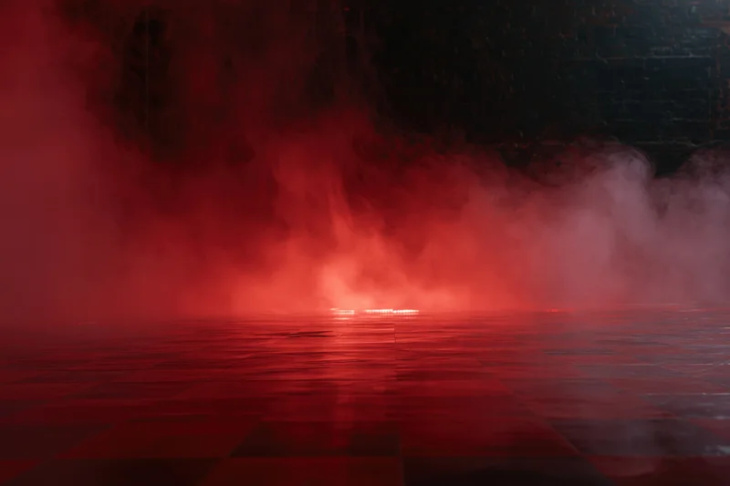 Red smoke rolling across dark tiled floor in empty room interior