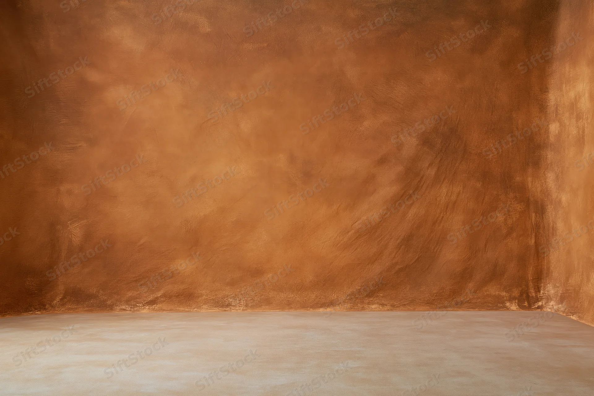 Warm hand-painted muslin backdrop in a studio corner with copyspace for photography