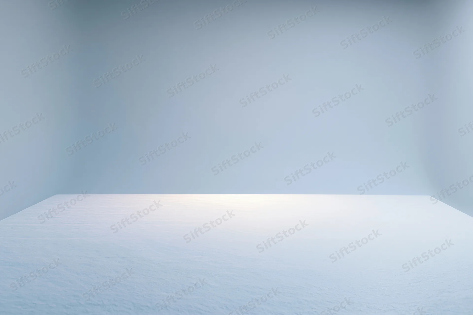 Seamless white paper backdrop in empty studio room with soft lighting and copyspace
